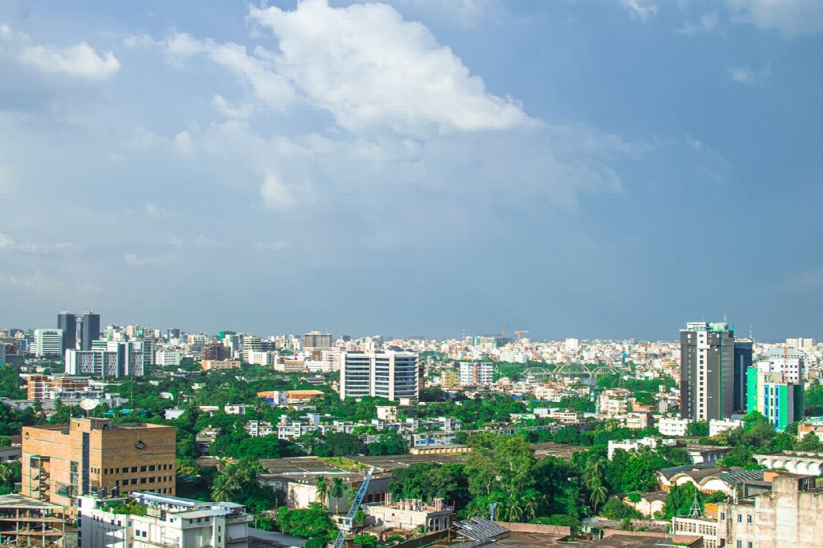 Dhaka city buildings under a bright sky