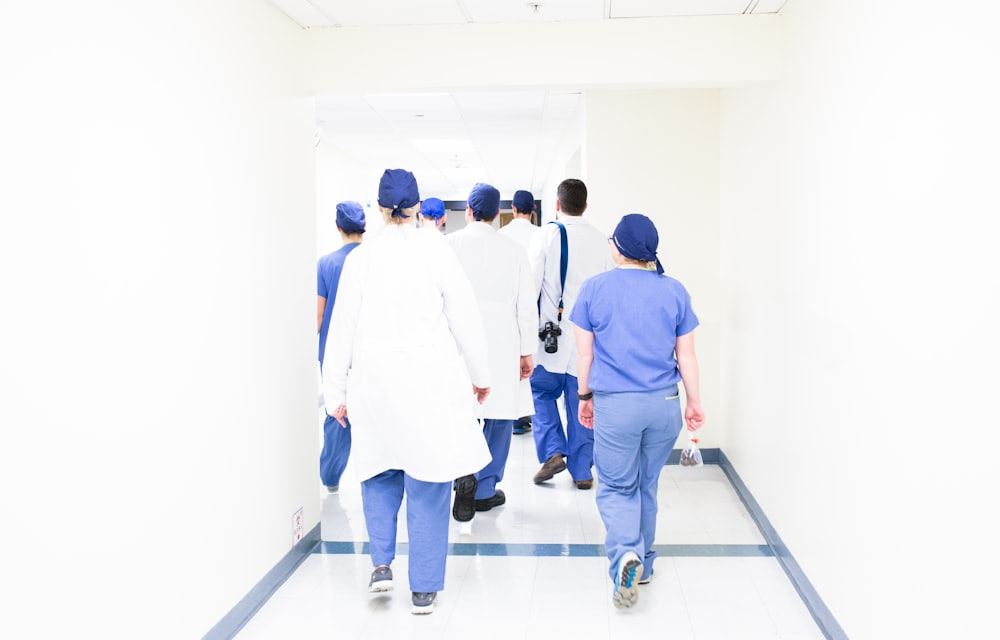 Medical professionals walking through a hospital corridor